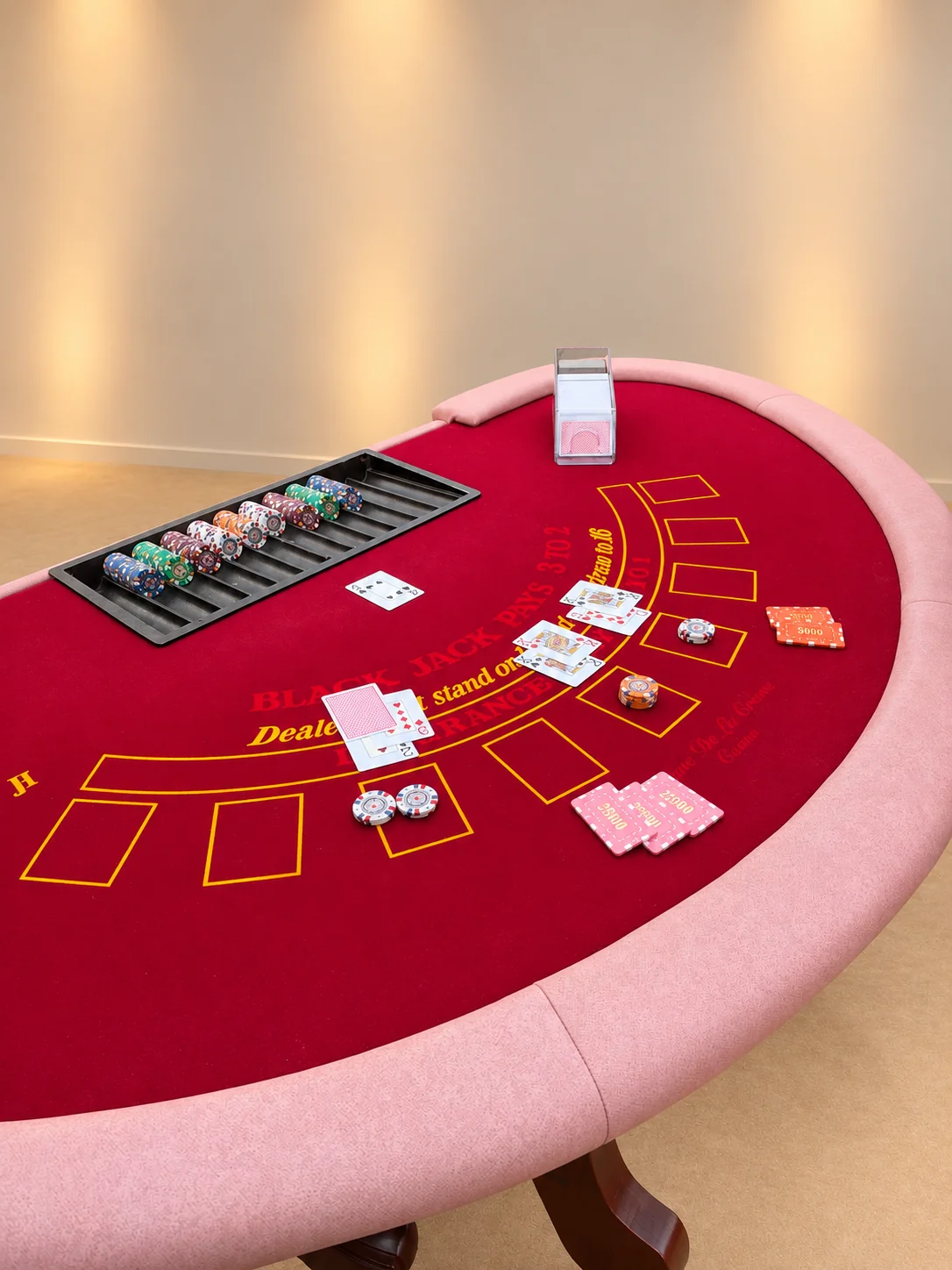 Close-up of the Blackjack felt with cards and chips laid out for a game