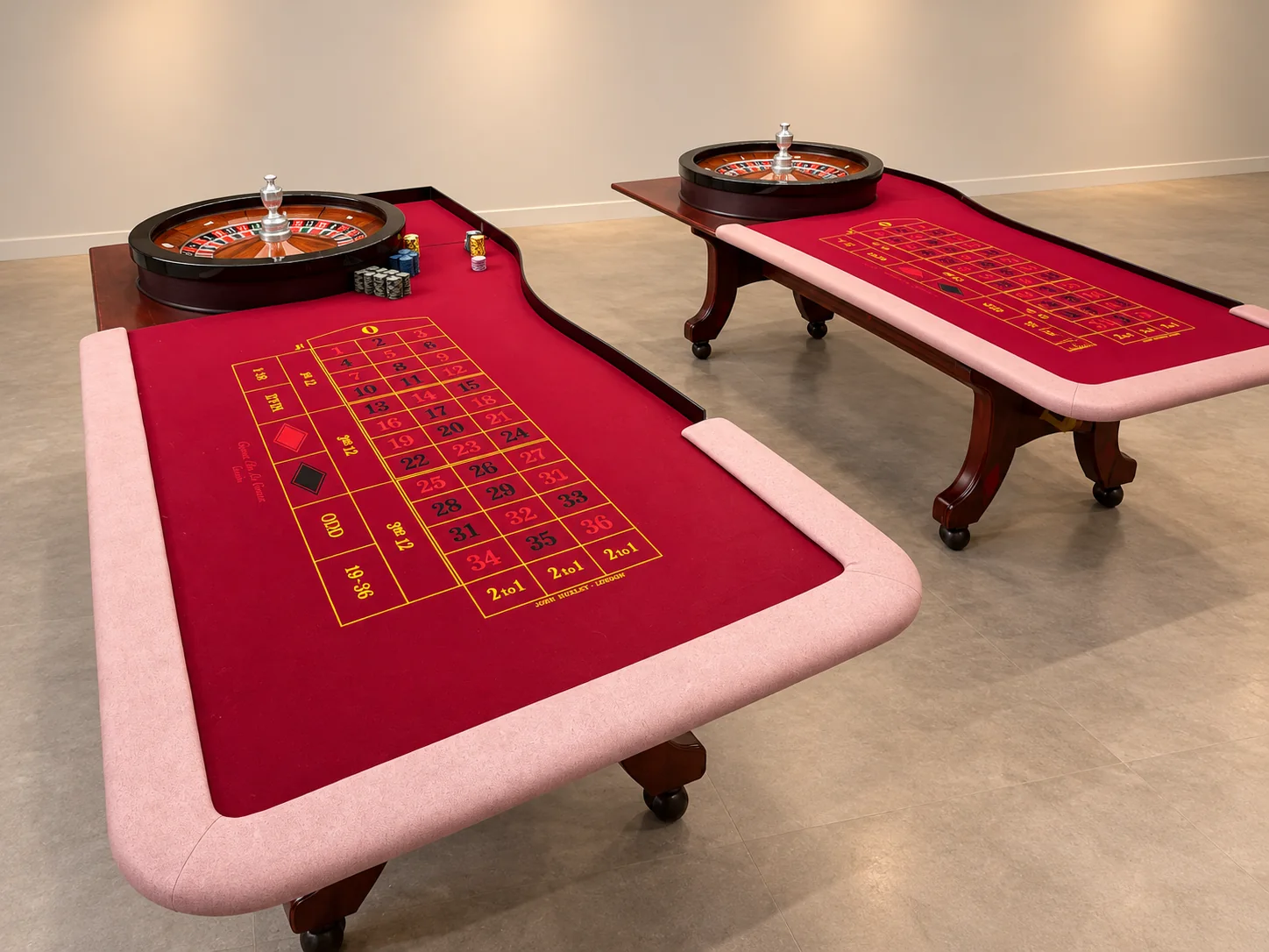 Enlarged image of two burgundy roulette tables used by YM Prestige